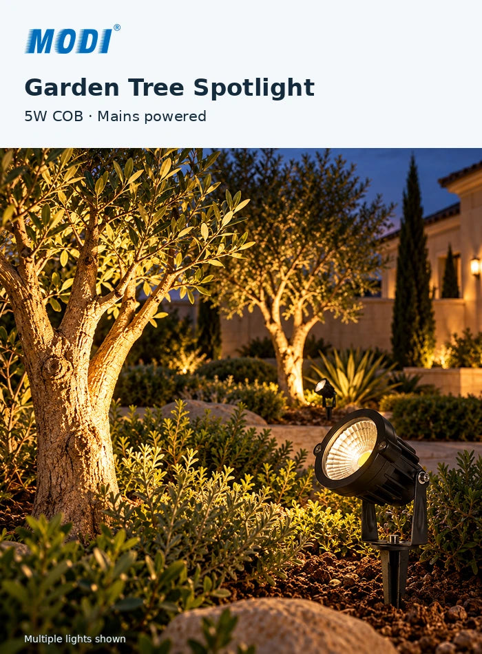 MODI 0205R COB garden spike light angled upwards towards an ornamental tree in a villa garden