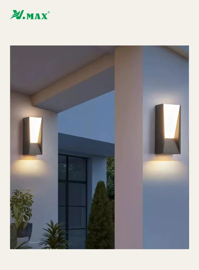 Two VMAX wall lights installed on villa entrance pillars at dusk