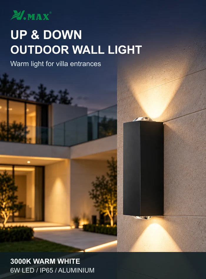 Black up and down outdoor wall light with warm white beams on a villa wall at dusk