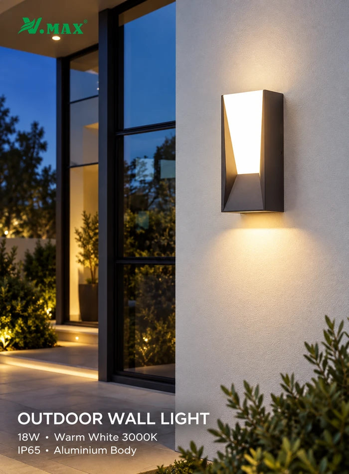 VMAX outdoor LED wall light illuminating a villa entrance with warm white light