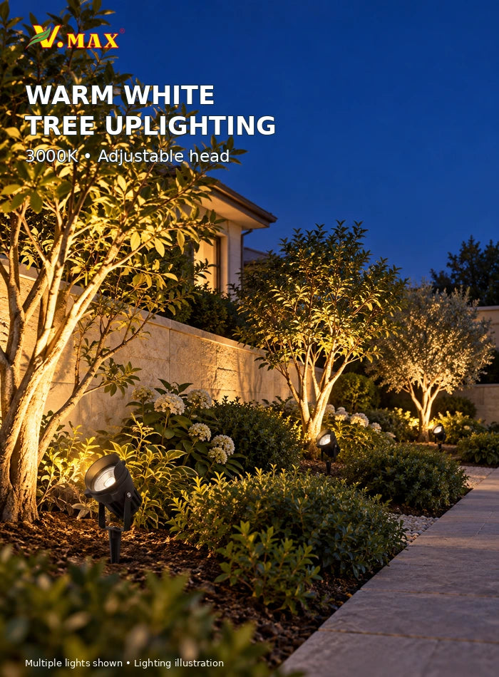 Three warm white 3000K garden spike lights aimed upward at trees in a villa planting bed