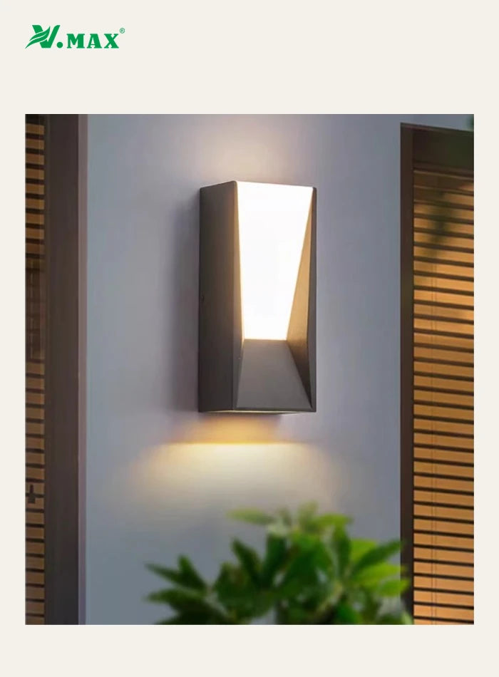 Close view of the installed VMAX wall light and its warm downward wall illumination