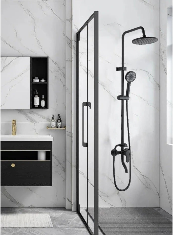 Black rainfall shower system installed beside a glass shower enclosure