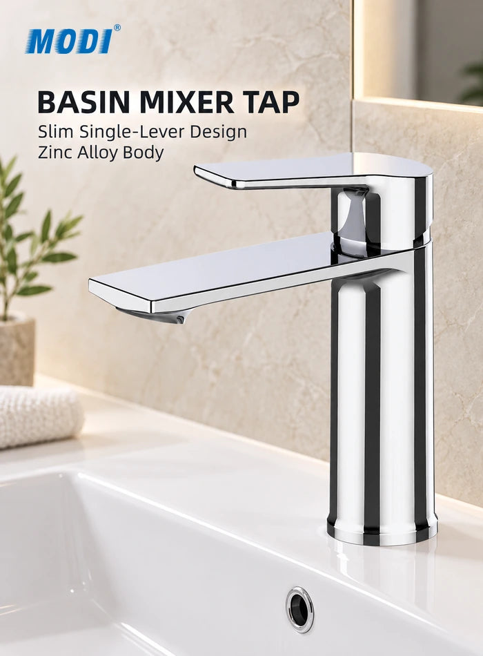 Chrome basin mixer tap with slim single lever and flat spout installed beside a bathroom basin