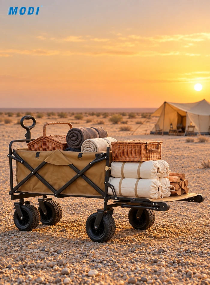 Folding wagon with open tailgate carrying picnic supplies at a desert campsite