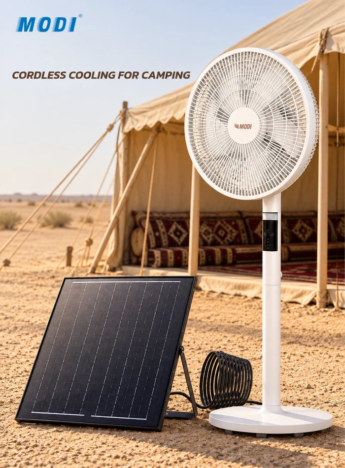 White MODI solar rechargeable pedestal fan and solar panel beside an outdoor majlis tent